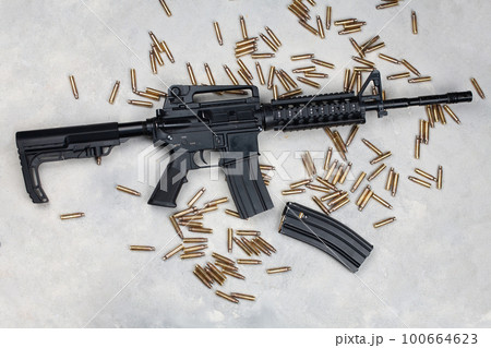 M4 carbine and 5.56mm shells and magazine with bullets 100664623