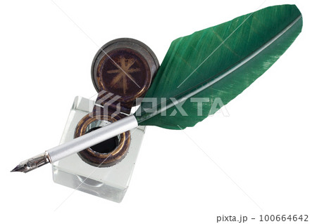 Old vintage feather quill with glass inkwell 100664642