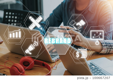 Marketing and brand management concept, Business team using laptop computer with rebrand icon on virtual screen. 100667207