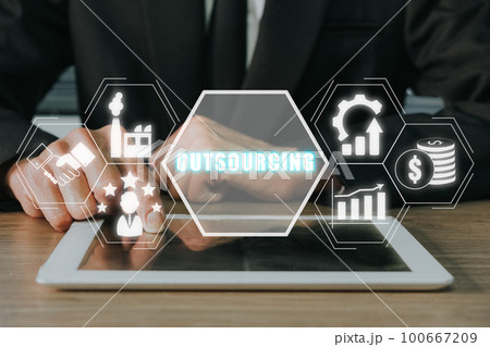 Outsourcing Global Recruitment Business and internet concept, Business person hand touching digital tablet with outsourcing icon on virtual screen. 100667209