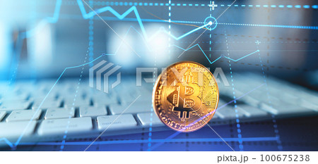 Golden bitcoins. Cryptocurrency on computer desk and Double Exposure chart Golden bitcoins. Cryptocurrency on computer desk and Double Exposure chart 100675238