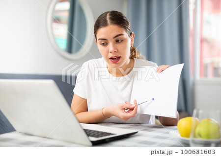 Woman studying during online courses using laptop Woman studying during online courses using laptop 100681603