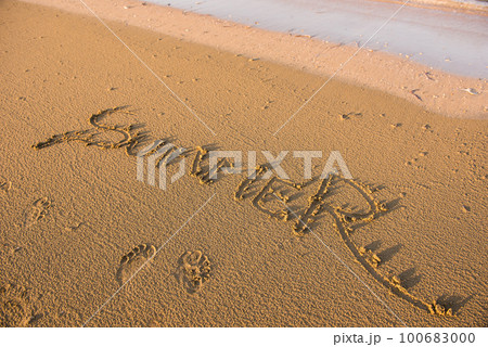 Summer word written in sand 100683000