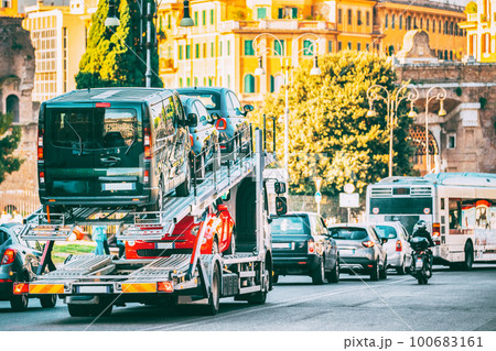 Auto-transport Carrying New Fiat Cars In European City Street. Auto Transport Broker Or Car Transporter. Auto-transport Carrying New Fiat Cars In City Street. Auto Transport Broker Or Car Transporter. Auto-transport Carrying New Fiat Cars In European City Street. Auto Transport Broker Or Car Transporter. Auto-transport Carrying New Fiat Cars In City Street. Auto Transport Broker Or Car Transporter. 100683161