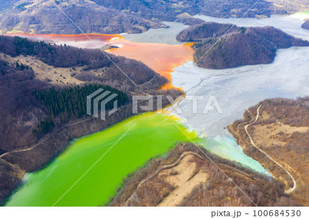 Aerial view of a lake filled with chemical waste water Aerial view of a lake filled with chemical waste water 100684530