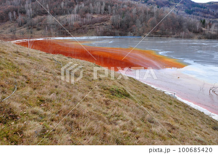 Pollution of a lake with contaminated water from a gold mine. 100685420