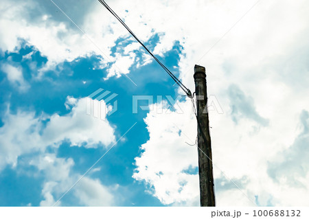 Power electric pole with line wire on colored background close up 100688132