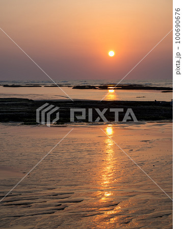 sunset at beach in golden background 100690676