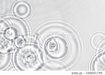 Abstract water, cosmetic background with rings, water surface. Spa concept background. Splash cosmetic moisturizer water micellar toner or emulsion 100691799