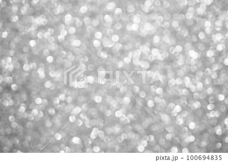 Abstract blur silver glitter sparkle defocused bokeh light background 100694835
