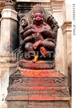 Old deity of Narasimha, the avatar of the Hindu god Vishnu, in a public square in Bhaktapur, Nepal 100695478