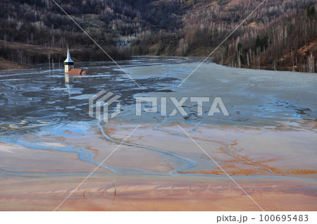 Abandoned church flooded by a lake full with chemical residuals. Geamana, Rosia Montana Abandoned church flooded by a lake full with chemical residuals. Geamana, Rosia Montana 100695483
