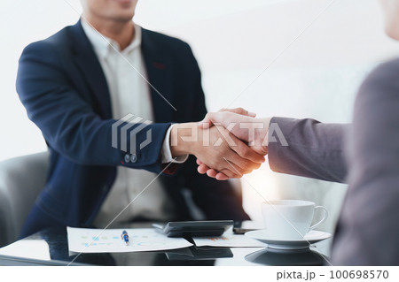 Business Partnerships Handshake at Meeting room. corporate collaboration successful. handshaking after good deal 100698570