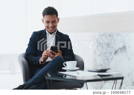 Beautiful Business man completes KYC using an online banking program in order to open a digital savings account. The definition of cyber security 100698577