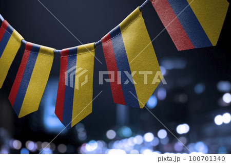 A garland of Colombia national flags on an abstract blurred background 100701340