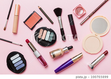 Professional makeup tools. Top view. Flat lay. Beauty, decorative cosmetics. Makeup brushes set and color eyeshadow palette on table background. Minimalistic style 100703899