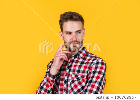 Hip and stylish. well groomed hairstyle. male beauty and fashion look. hipster checkered shirt for bearded guy. unshaven handsome man with bristle. hairdresser concept. young and confident 100703957