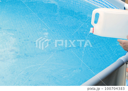 Cleaning a PVC frame pool from algae by pouring perhydrol, Concept of cleaning services 100704383