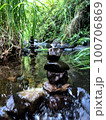 Balanced zen rock stacks in a creek. 100706869