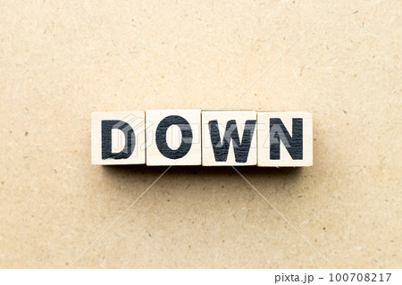 Alphabet letter block in word down on wood background Alphabet letter block in word down on wood background 100708217