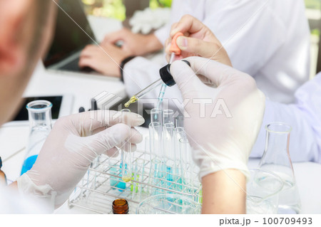 Team of researcher or scientists working in laboratory. Team of researcher or scientists working in laboratory. 100709493