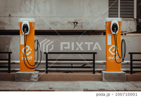 Front view of The Evolt electric car charging point at a car park. Electric Vehicle Charging Station in a commercial parking lot. 100710001