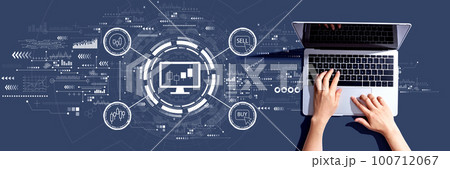 Stock trading theme with person using a laptop 100712067