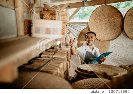 male handicraft artist working at his shop male handicraft artist working at his shop 100715696