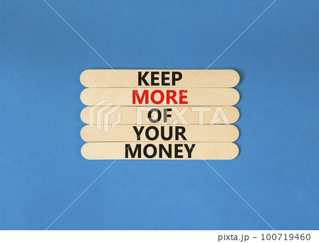 Keep more of your money symbol. Concept words Keep more of your money on wooden stick. Beautiful blue table blue background. Business keep more of your money concept. Copy space. Keep more of your money symbol. Concept words Keep more of your money on wooden stick. Beautiful blue table blue background. Business keep more of your money concept. Copy space. 100719460
