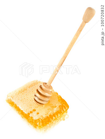 Honey in honeycomb and dipper isolated on white . Vertical photo. 100720832