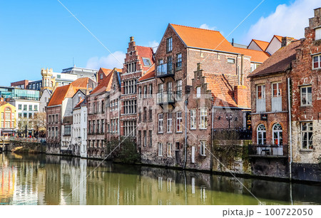 The river and medieval houses of Ghent, a city in the Flemish region of Belgium. Travel concept 100722050