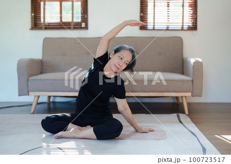 stress relief, muscle relaxation, breathing exercises, exercise, meditation, portrait of Young Asian woman relaxing her body from by practicing yoga stress relief, muscle relaxation, breathing exercises, exercise, meditation, portrait of Young Asian woman relaxing her body from by practicing yoga 100723517