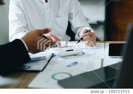 financial, Planning, Marketing and Accounting, Asian young Economist using calculator to calculate investment documents with partners on profit taking to compete with other companies financial, Planning, Marketing and Accounting, Asian young Economist using calculator to calculate investment documents with partners on profit taking to compete with other companies 100723555
