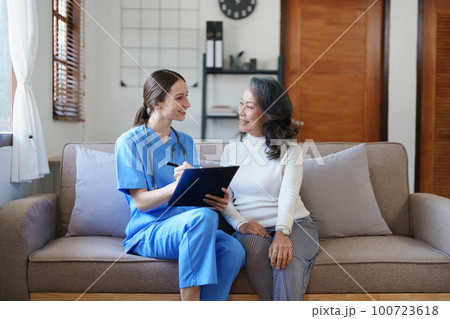 Portrait of a female doctor holding a patient clipboard to discuss and analyze the patient's condition before treating Portrait of a female doctor holding a patient clipboard to discuss and analyze the patient's condition before treating 100723618