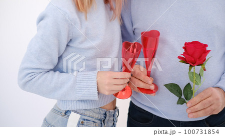 Lovely couple wearing matching shirts. Love celebration concept. Lovely couple wearing matching shirts. Love celebration concept. 100731854