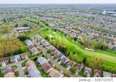 An aerial view of small American town you can see residential complex, houses, and roads An aerial view of small American town you can see residential complex, houses, and roads 100732935
