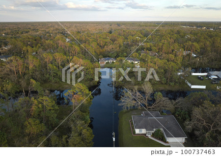 Surrounded by hurricane Ian rainfall flood waters homes in Florida residential area. Consequences of natural disaster Surrounded by hurricane Ian rainfall flood waters homes in Florida residential area. Consequences of natural disaster 100737463