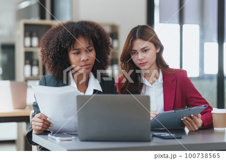 Multiethnic business people in meeting. Accountant people do document, tax, exchange, accounting and Financial advisor concept 100738565