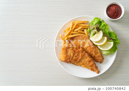 Homemade Breaded Weiner Schnitzel with Potato Chips 100740842
