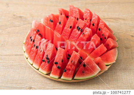 fresh watermelon sliced on plate 100741277