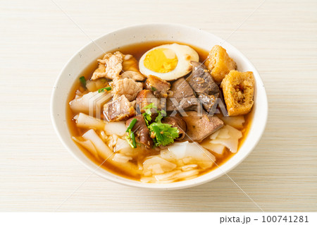 paste of rice flour or boiled Chinese pasta square in clear soup 100741281