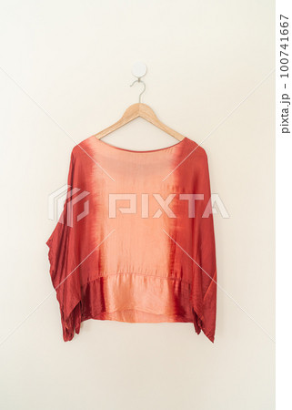 tie dye shirt hanging on wall 100741667