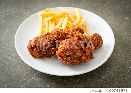 spicy Korean fried chicken with fries 100741978