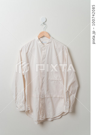hanging shirt with wood hanger on wall hanging shirt with wood hanger on wall 100742085