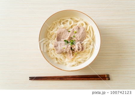 udon noodles with pork in clear soup udon noodles with pork in clear soup 100742123