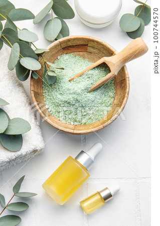 Soap, eucalyptus, towel, massage salt, aroma oil, spa objects on white tile background. Soap, eucalyptus, towel, massage salt, aroma oil, spa objects on white tile background. 100744570