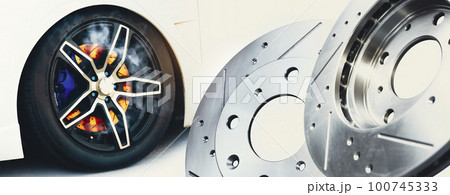 The new metal brake discs of the car and the brake discs burned in the wheels 100745333