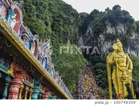 Golden Statue view during Thaipusam with temple architecture 100746309
