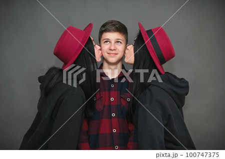 two beautiful brunette girls kiss a guy two beautiful brunette girls kiss a guy 100747375