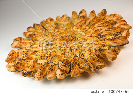 Sun recipe in puff pastry with smoked salmon and boursin cheese 100748460